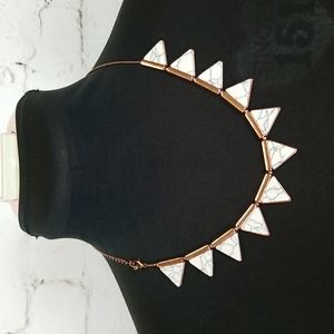 Semi precious stone in copper look metal necklace.